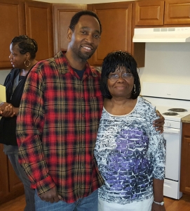 Habitat homeowner with family at home dedication