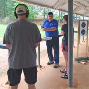 Mike Wasielewski demonstrates firearm safety procedures at the pistol range of the South River Gun Club