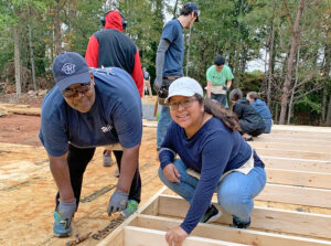 Homeowner and other volunteers on a build site